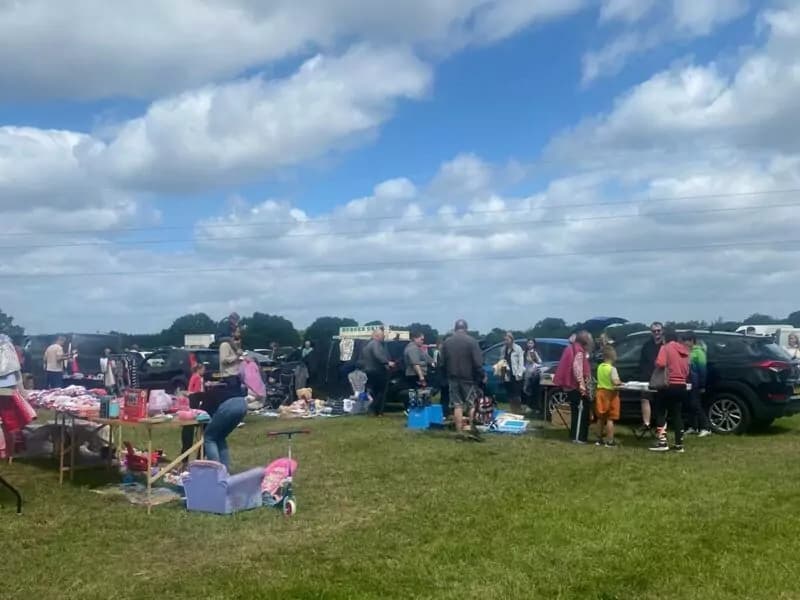 Shoppers browsing tables and open vehicles at Redhill Car Boot Sale Source: https://eboots.co.uk/listing/redhill-car-boot-sale/