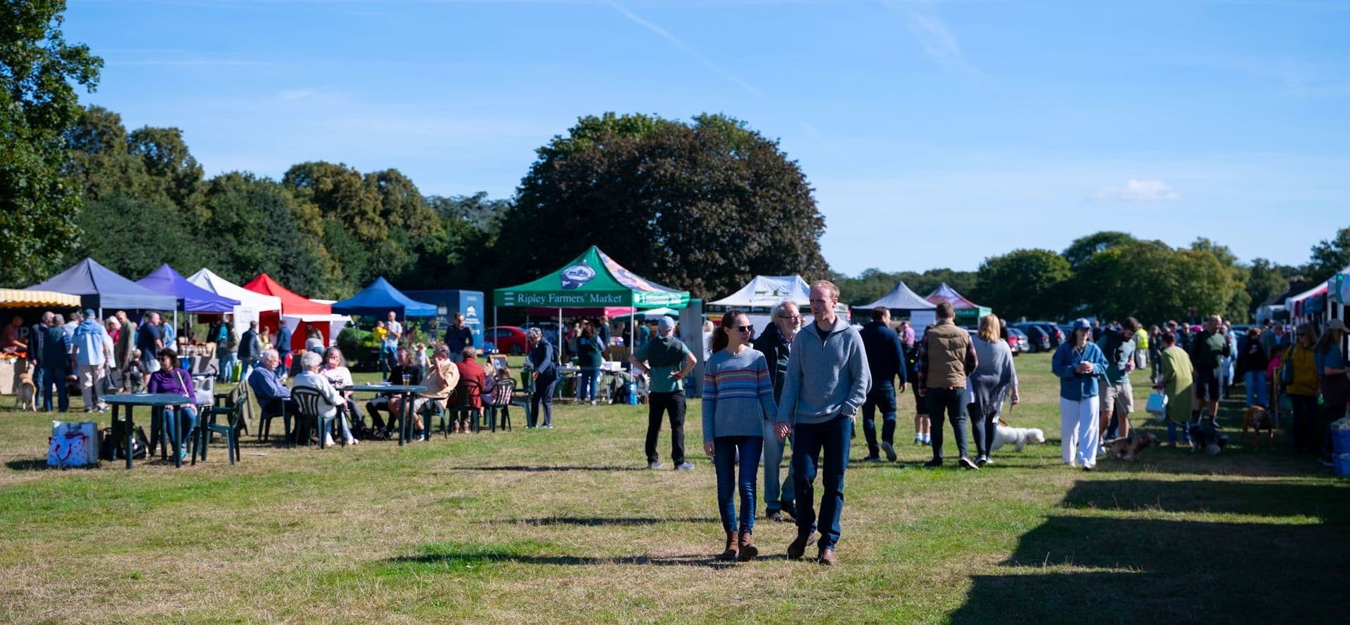 Ripley Farmers' Market on the Village Green, photographed by Natalia Prykhodko. Source: https://www.ripleyfarmersmarket.co.uk/gallery