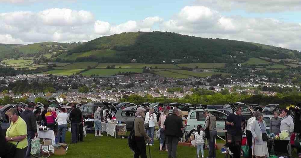 Cars, tables of goods and shoppers at Pen-y-fal Car Boot Sale above Abergavenny. Source: https://www.findcarboot.co.uk/pen-y-fal-car-boot-sale/