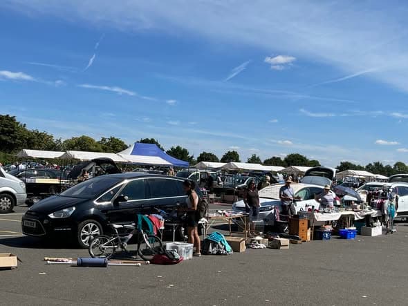 Stonham Barns car boot with cars, outdoor stalls and shoppers. Source: https://www.facebook.com/events/1302845008315220/?post_id=1303198571613197