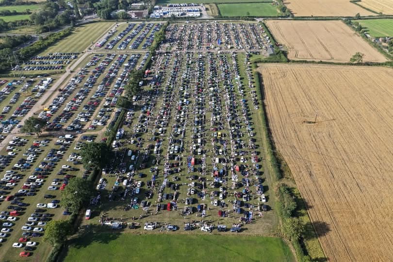 Official Croft Carboot aerial photograph showing the event field filled with cars, stalls and shoppers. Source: https://www.facebook.com/CroftCarBoot
