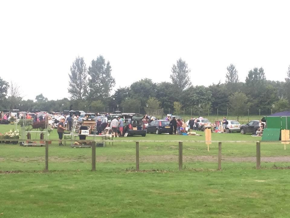 Cars, sellers and shoppers spread across the field at Mersham Le Hatch CC Boot Fair. Source: https://www.facebook.com/MLHCCBootFair/