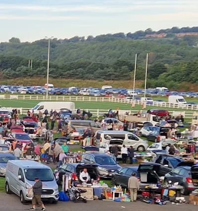 Blaydon Car Boot Sale with cars, tables, sellers and shoppers across the rugby ground Source: https://blaydonrfc.co.uk/car-boot-sale/