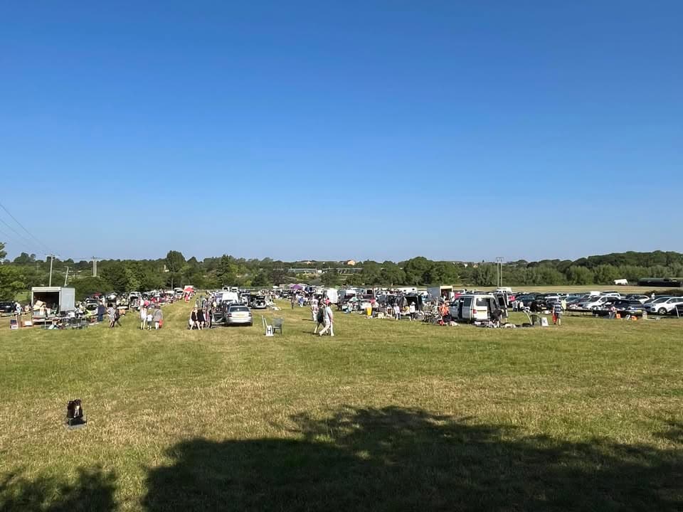 Cars, stalls and shoppers across the field at Evesham Wednesday Car Boot Source: https://www.facebook.com/eveshamwednesdaycarboot/