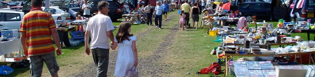 Families browsing rows of stalls and cars at Thanet Lions Drapers Mill Boot Fair. Source: https://www.thanetlions.org.uk/boot-fairs