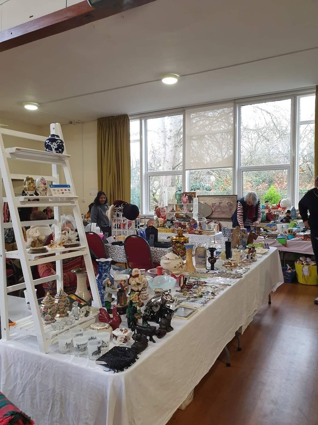 Tables of second-hand goods and shoppers inside Purley Indoor Boot Sale at St Mark's Church Hall. Source: https://www.facebook.com/photo.php?fbid=741013281578283