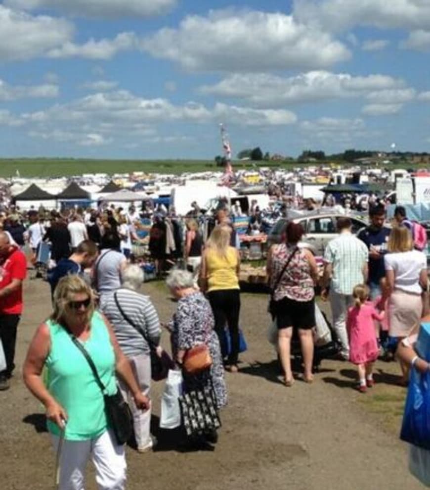 Shoppers browsing rows of cars, vans and stalls at Weeley Car Boot Sale. Source: https://www.thebootgroup.com/