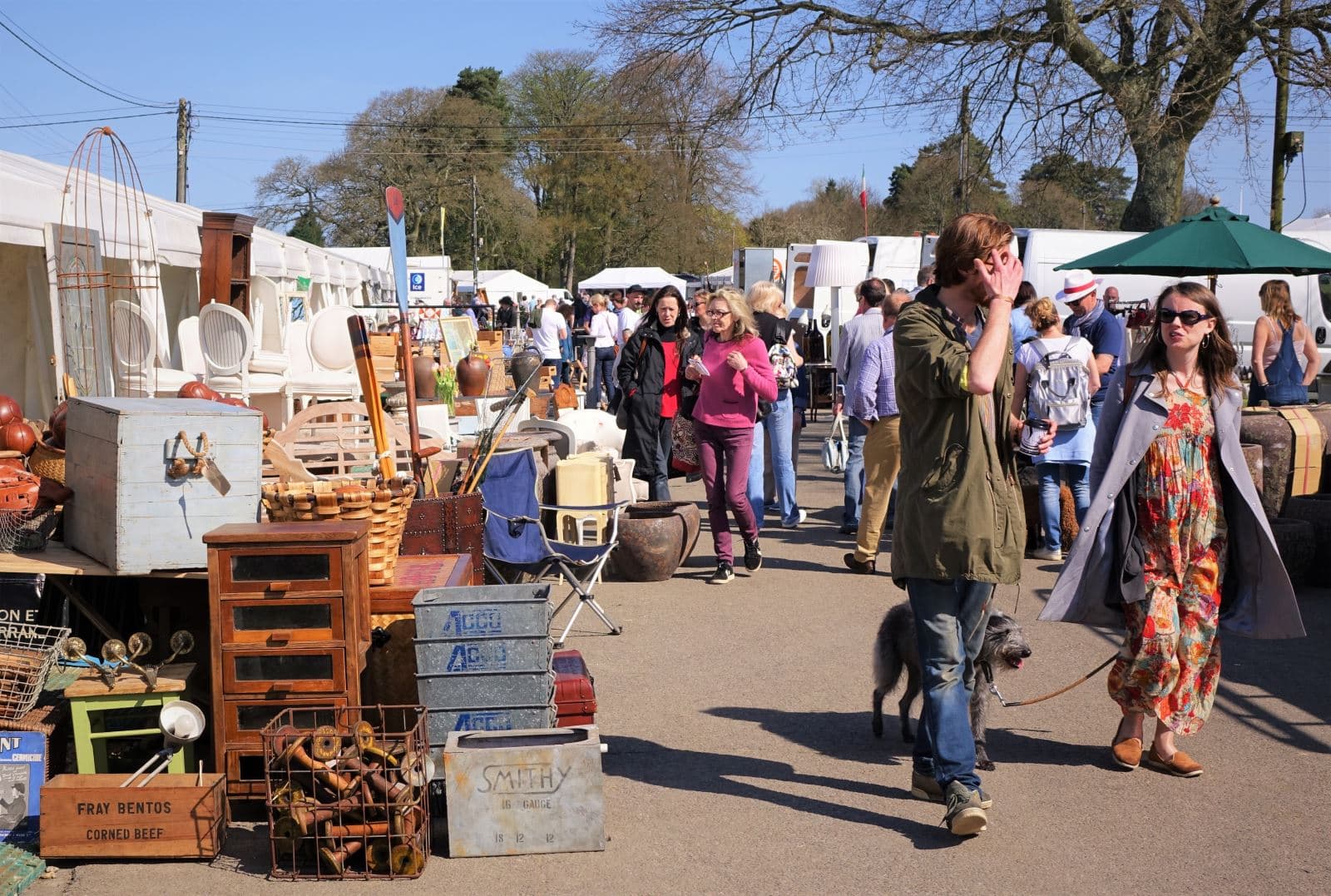 Official Ardingly fair image showing outdoor antiques stalls, furniture, goods and shoppers at the South of England Showground. Source: https://www.iacf.co.uk/ardingly/