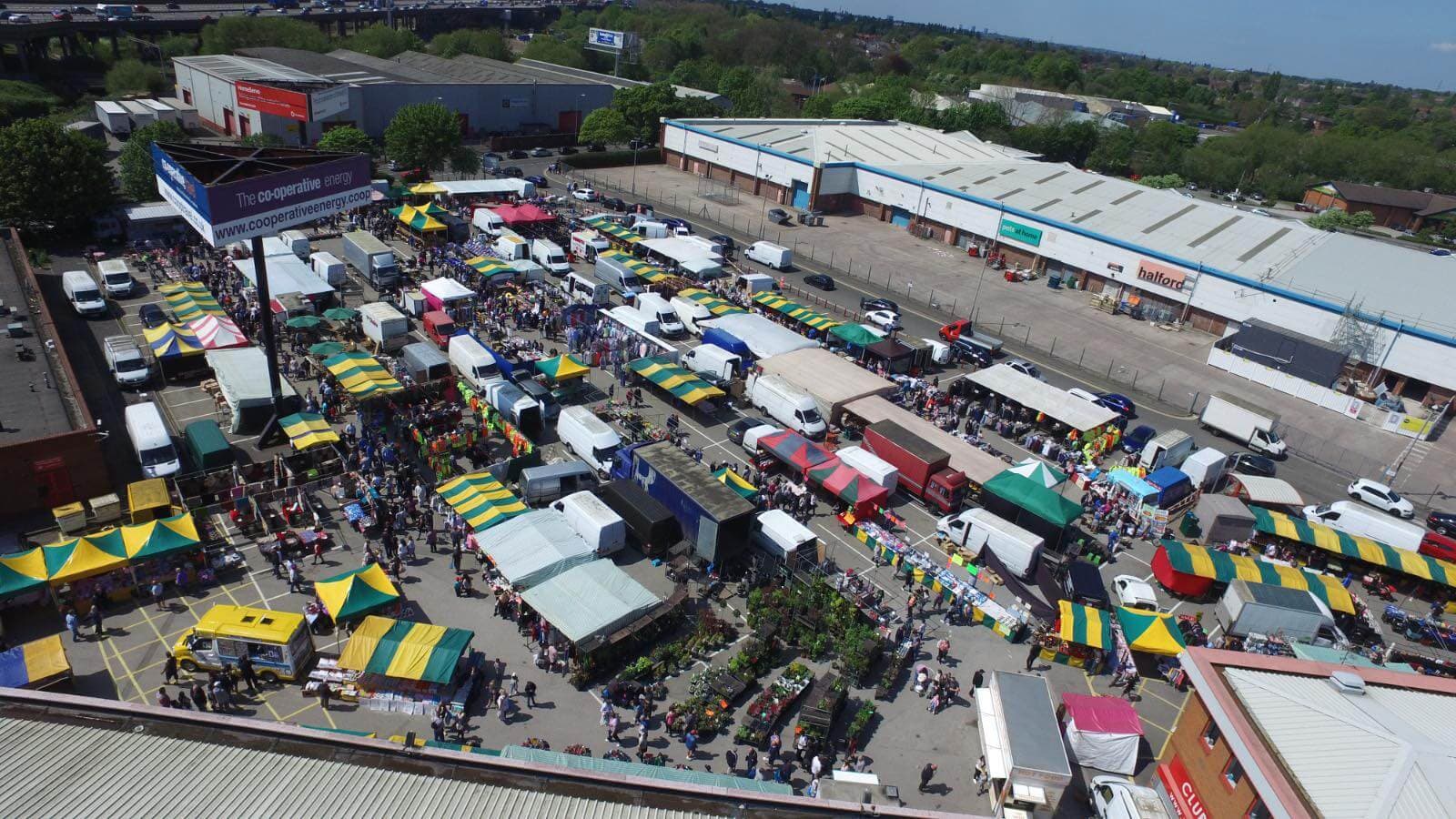 Aerial view of Bescot Market and Car Boot with vehicles, stalls and shoppers on the hardstanding Source: https://www.findcarboot.co.uk/bescot-market-car-boot/