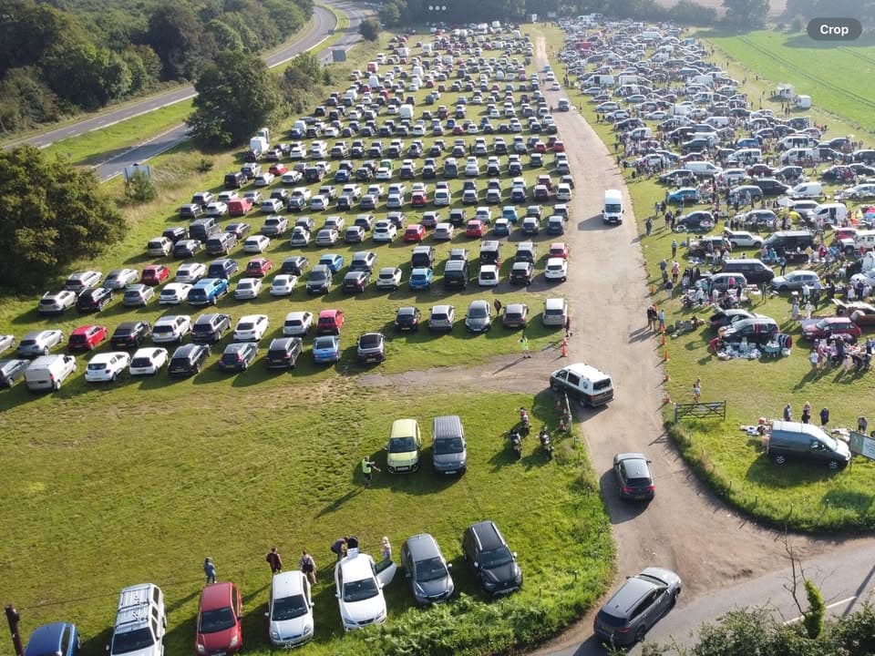 Aerial view of cars, stalls and shoppers across Friday Street Car Boot Sale