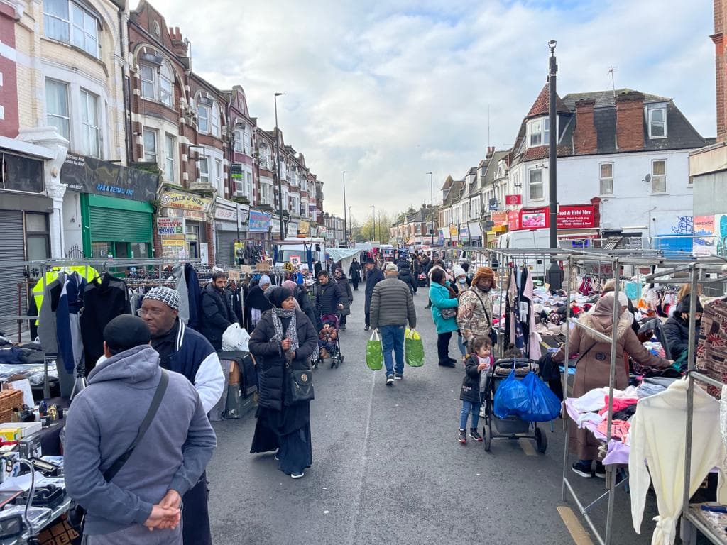 Willesden Market traders and shoppers along Church Road Source: https://www.saundersmarkets.co.uk/willesden-market