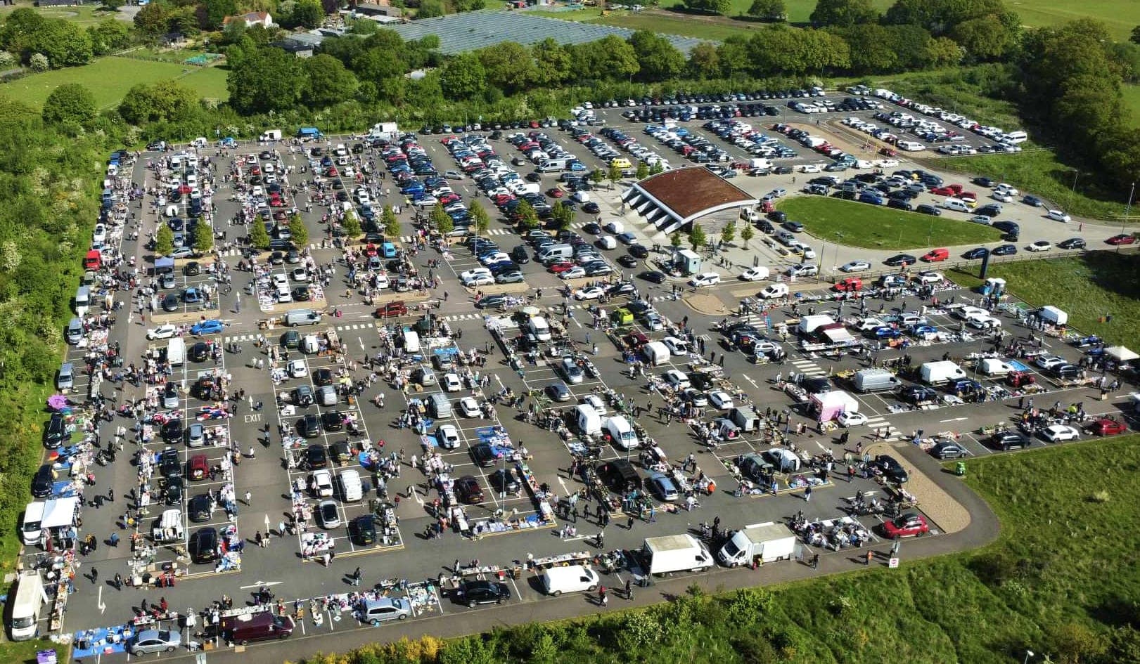 Aerial view of Colchester Car Boot Sale with cars, stalls and shoppers at the park and ride. Source: https://capitalbootsales.co.uk/app/uploads/2023/01/IMG_2999.jpg