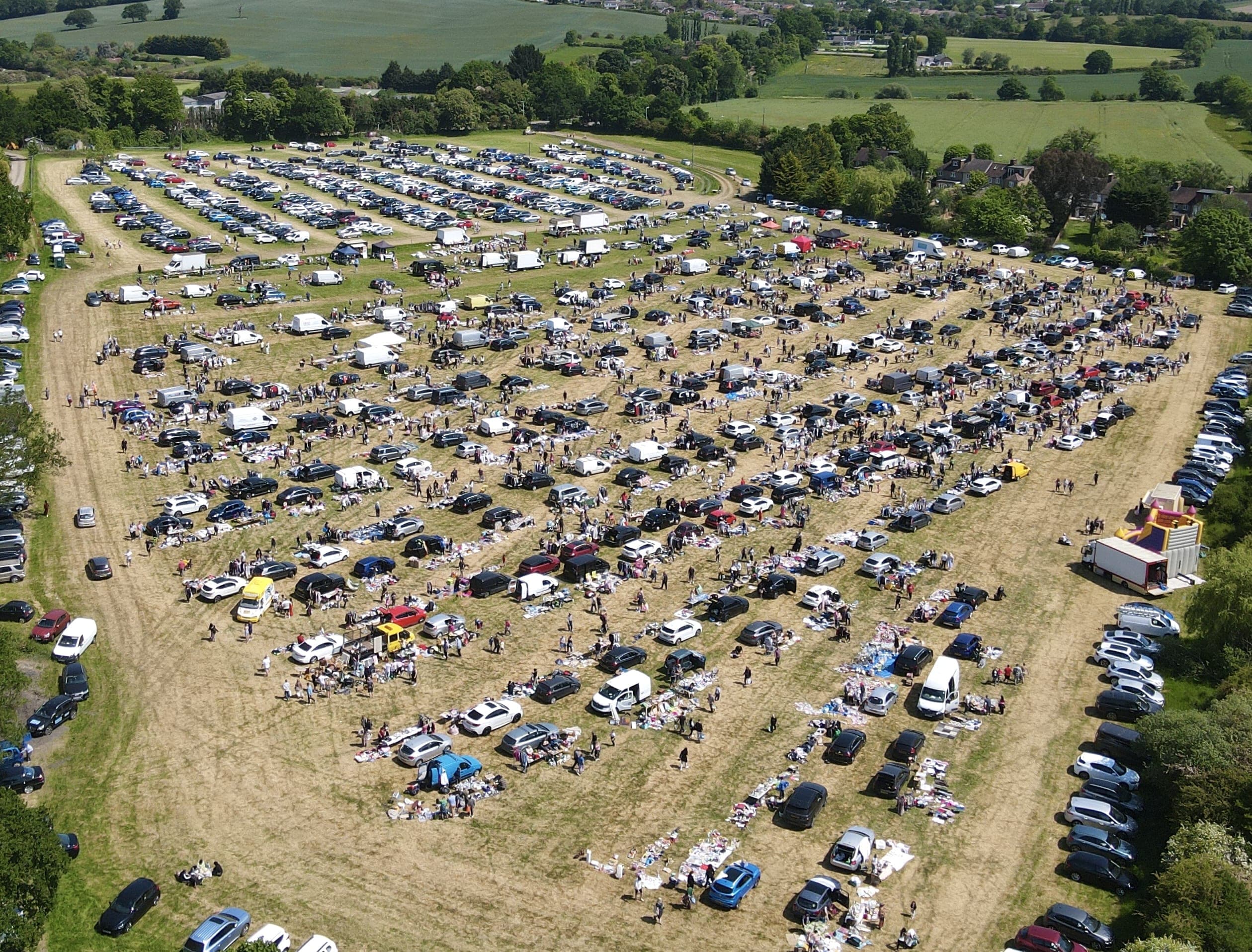 Aerial view of Cuffley Car Boot Sale with cars, stalls, goods and shoppers at Hill View Farm. Source: https://capitalbootsales.co.uk/app/uploads/2023/01/dji_fly_20230604_113320_238_1685874816525_photo-2.jpg