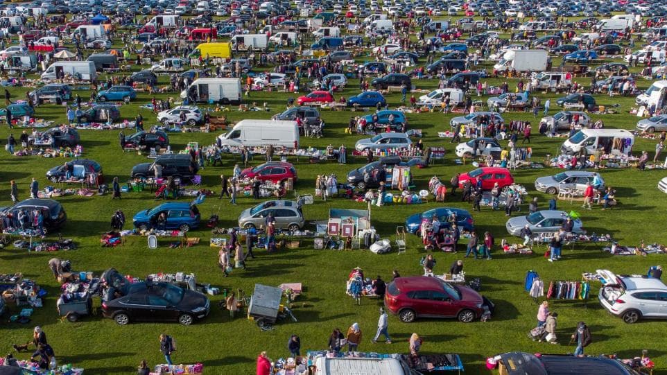 Busy aerial view of cars, stalls and shoppers at Skylark Car Boot Source: https://www.wisbechstandard.co.uk/news/22645934.hundreds-go-bargain-hunting-sun-first-car-boot-since-lockdown/