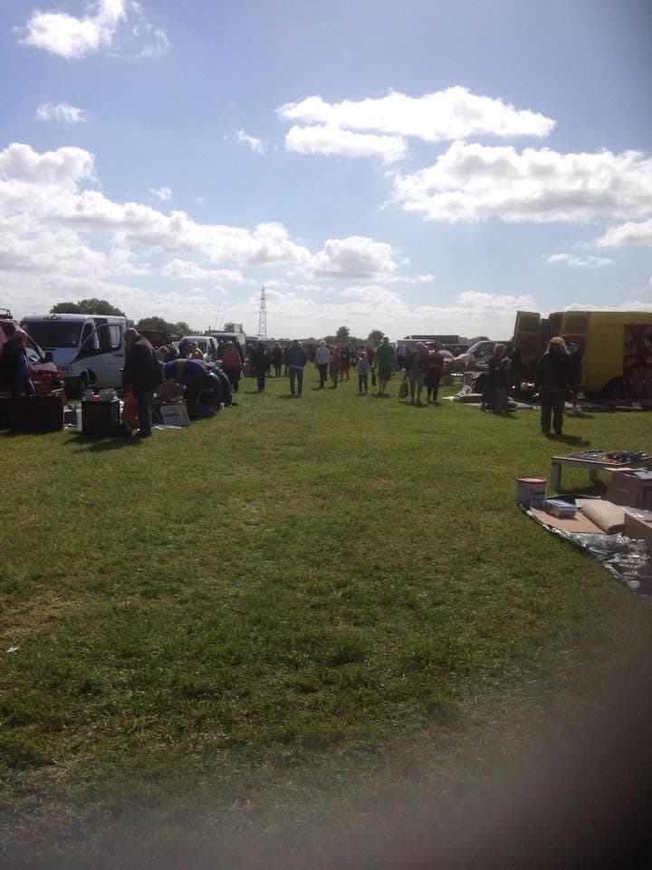 Shoppers browsing outdoor pitches beside cars and vans at Wood Farm Car Boot. Source: https://www.facebook.com/photo/?fbid=452372310273799