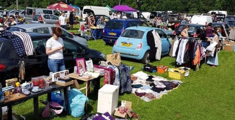 Cars, sellers, shoppers and second-hand goods across the grass at Castle Combe Circuit Car Boot Sale. Castle Combe Circuit. Source: https://castlecombecircuit.co.uk/car-boot-sales/