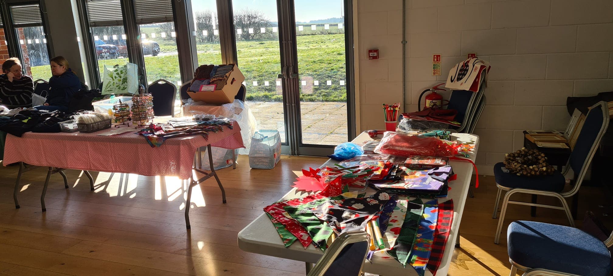 People and craft tables at Trimingham Hall's jumble and table-top sale. Source: https://trimingham.org/wp-content/uploads/2025/01/j2.jpg