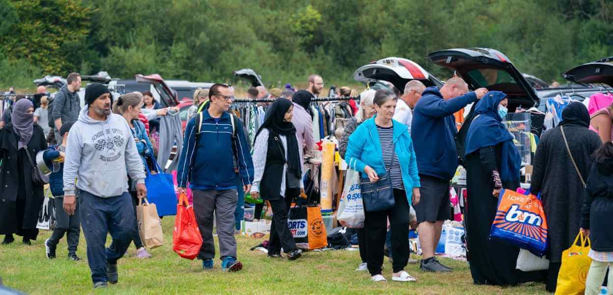 Shoppers browsing busy rows of cars and stalls at Bowlee Source: https://www.rochdale.gov.uk/images/Bowlee_2026_gallery_2_1248_x_600.jpg