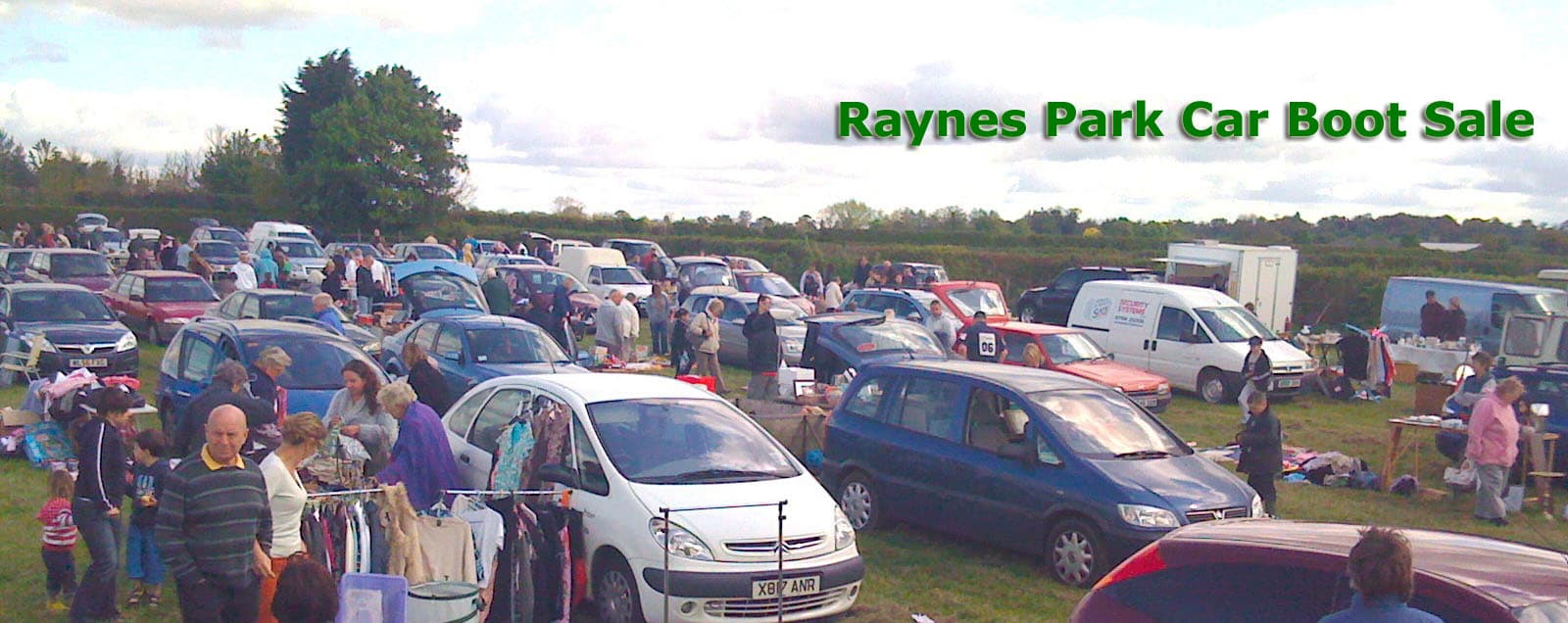 Cars, open boots, tables of goods and shoppers at Raynes Park Car Boot Sale on Prince Georges Playing Fields. Source: https://www.raynesparkcarbootsale.co.uk/Images/123.jpg