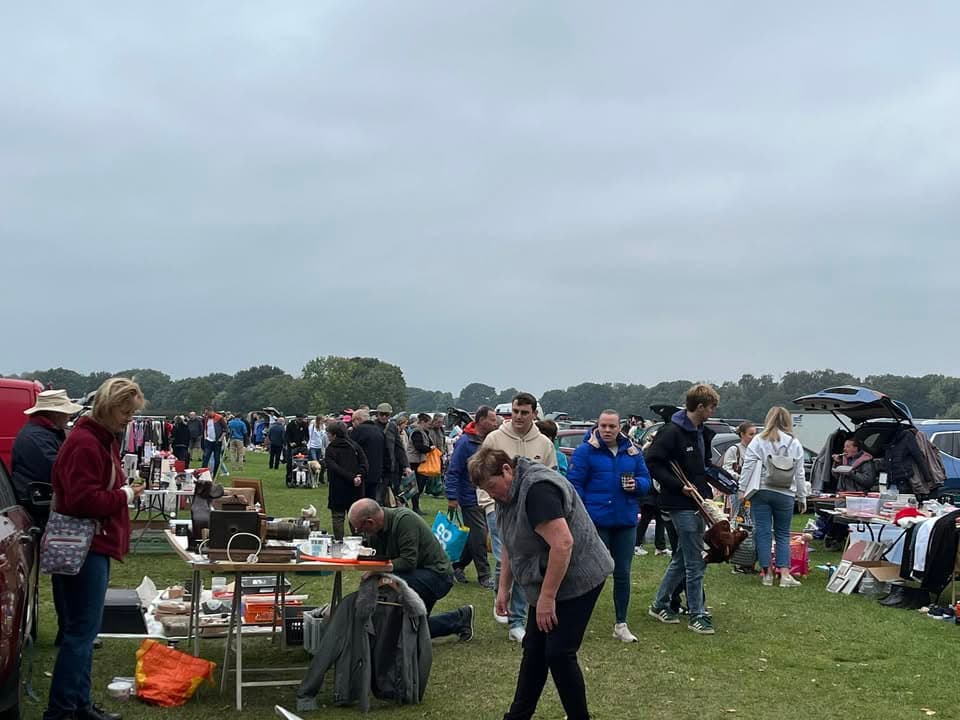 Wigginton Car Boot Sale with field stalls, cars and shoppers Source: https://www.facebook.com/profile.php?id=100057378404234