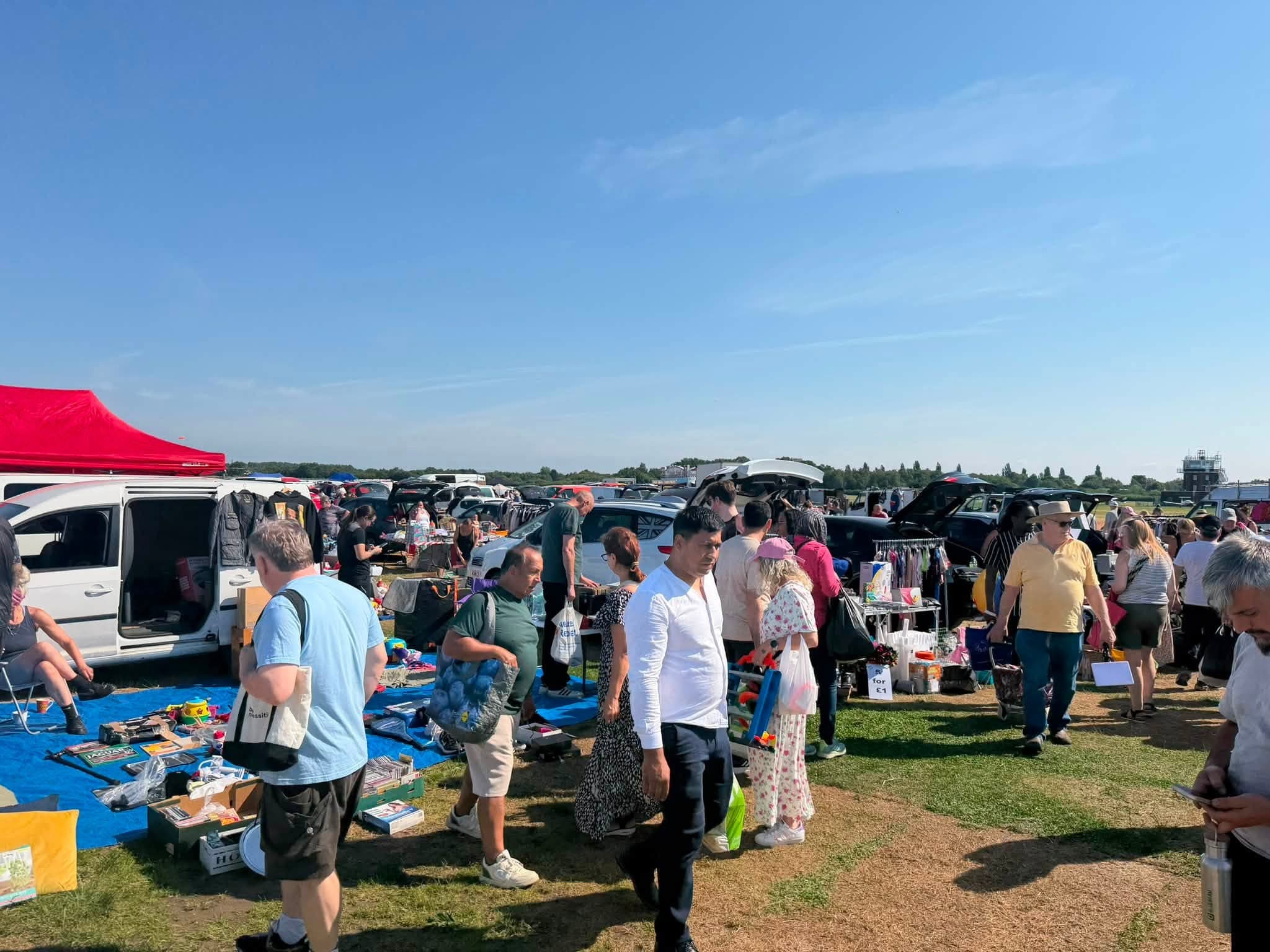 Busy Barton Aerodrome car boot with cars, stalls, goods and shoppers. Source: https://www.facebook.com/photo.php?fbid=1003187429139114&set=pb.100083435973253.-2207520000&type=3