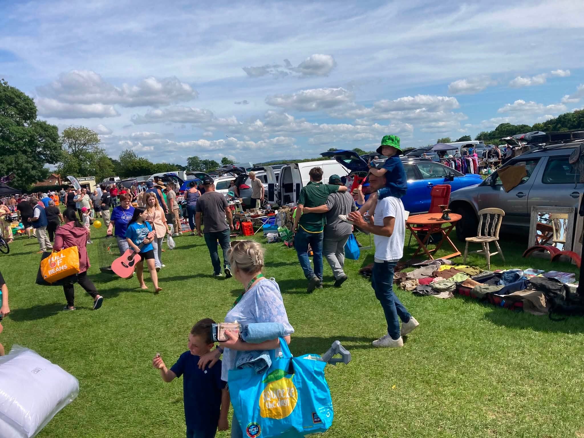 Busy Madley grass-field car boot with cars, seller rows and shoppers Source: https://scontent-lhr11-1.xx.fbcdn.net/v/t39.30808-6/736261035_1431016422394027_2004521338388001312_n.jpg